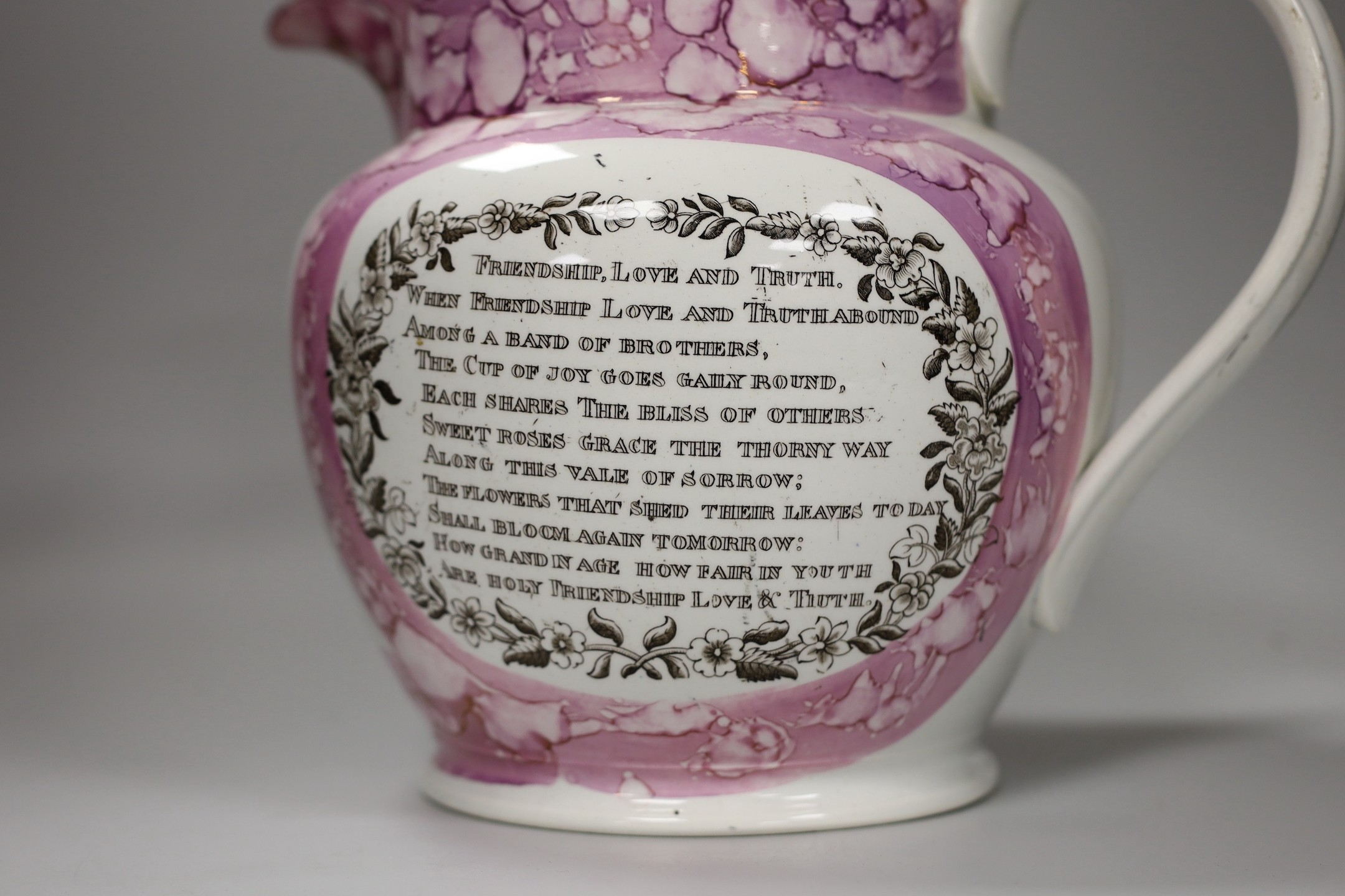 A Sunderland pink lustre ‘Northumberland 74’ and ‘ View of the iron bridge over the Wear’ jug, early 19th century, 23cm